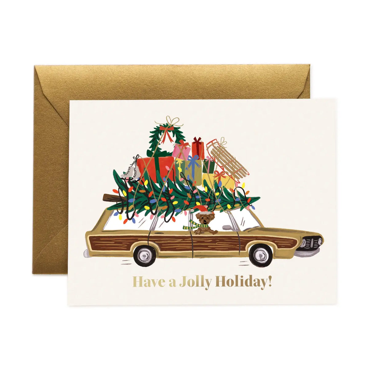 Rifle Paper Co. Jolly Holiday Christmas greeting card featuring a vintage station wagon loaded with Christmas presents, greenery, colorful lights, and a gold envelope.