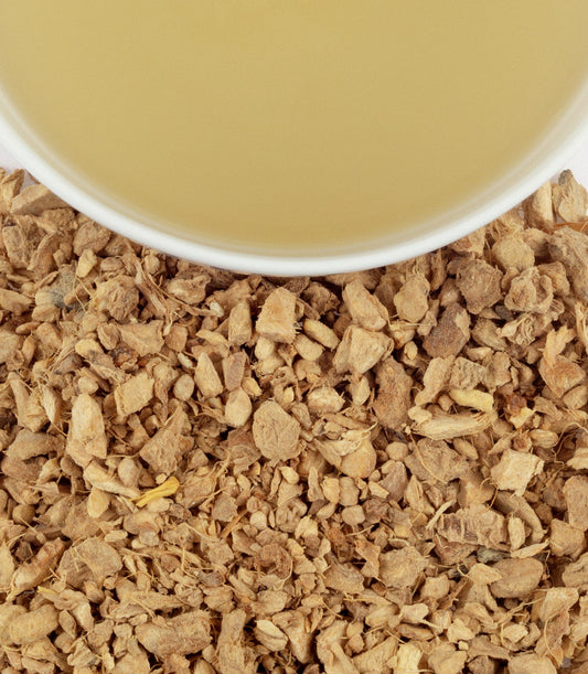 Brewed Harney and Sons Organic Ginger Lemon herbal tea with dried ginger pieces