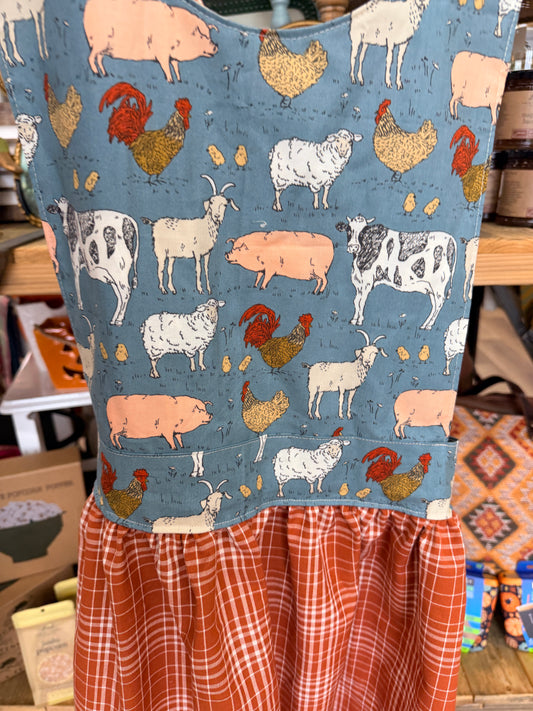 Blue farm animal apron fabric with cows pigs sheep goats chickens and roosters