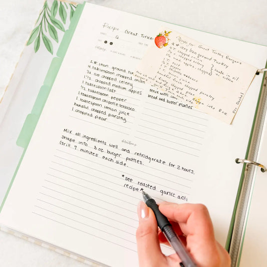 Large recipe binder with handwritten recipe pages and recipe card pocket