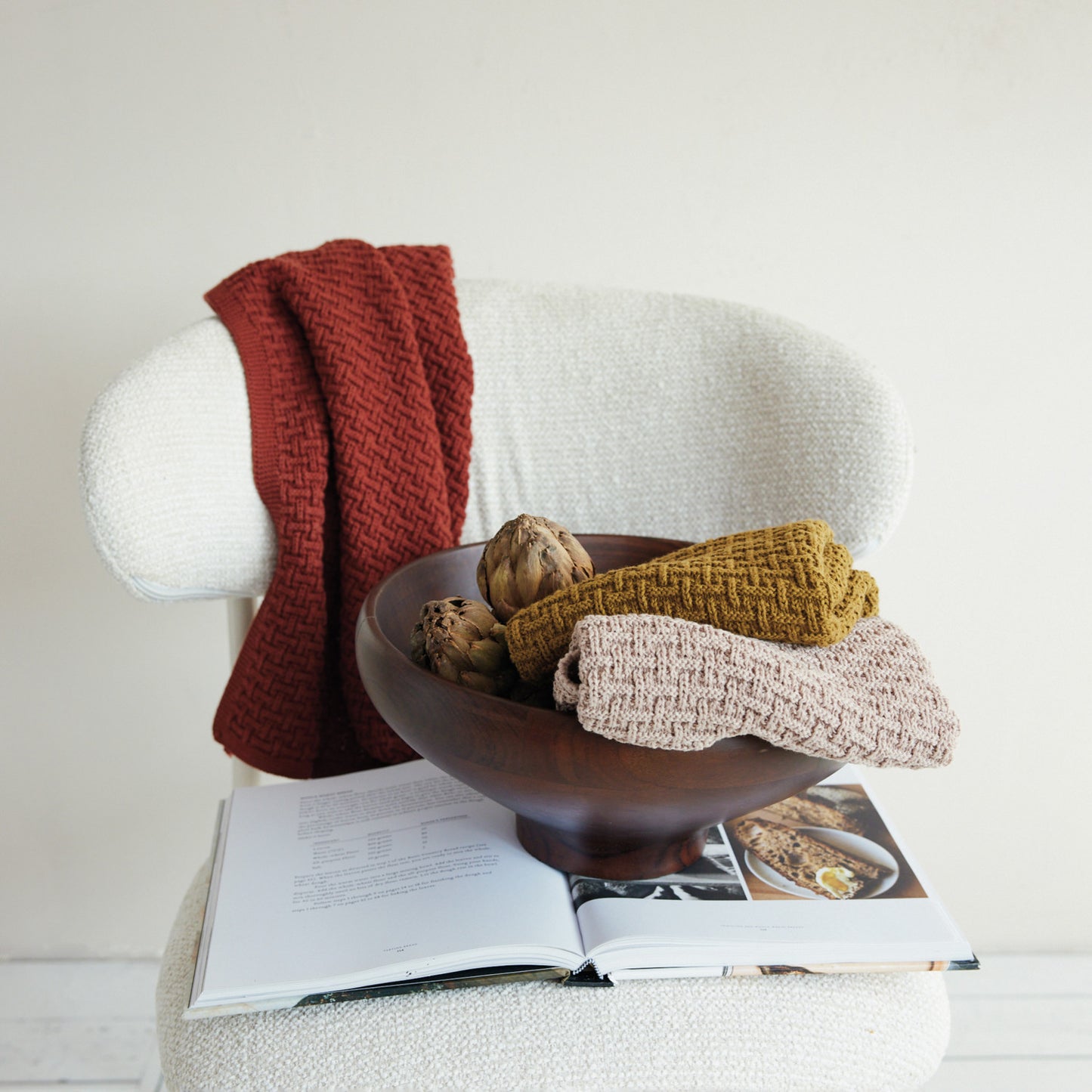 Cotton knit basketweave kitchen towels styled in warm fall colors with rustic home decor