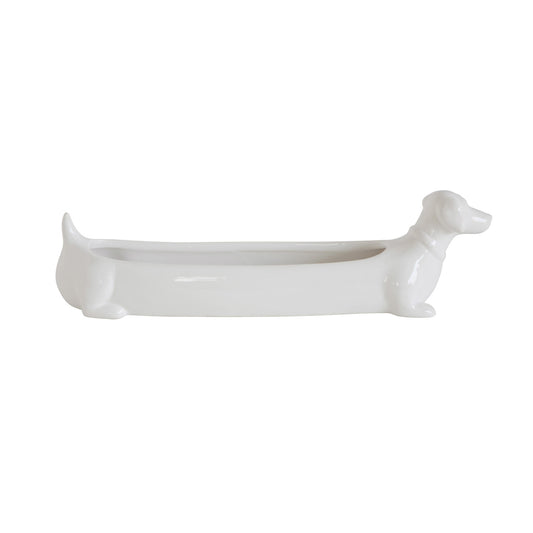 White ceramic dachshund cracker dish filled with crackers