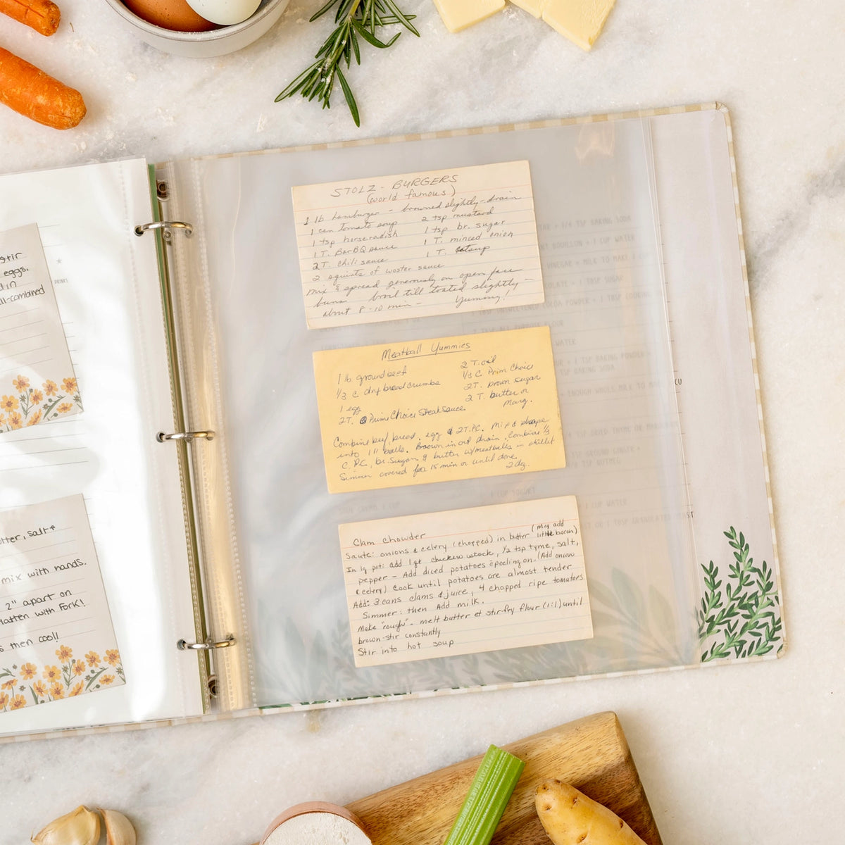 Protective recipe card sleeves inside large three-ring recipe organizer