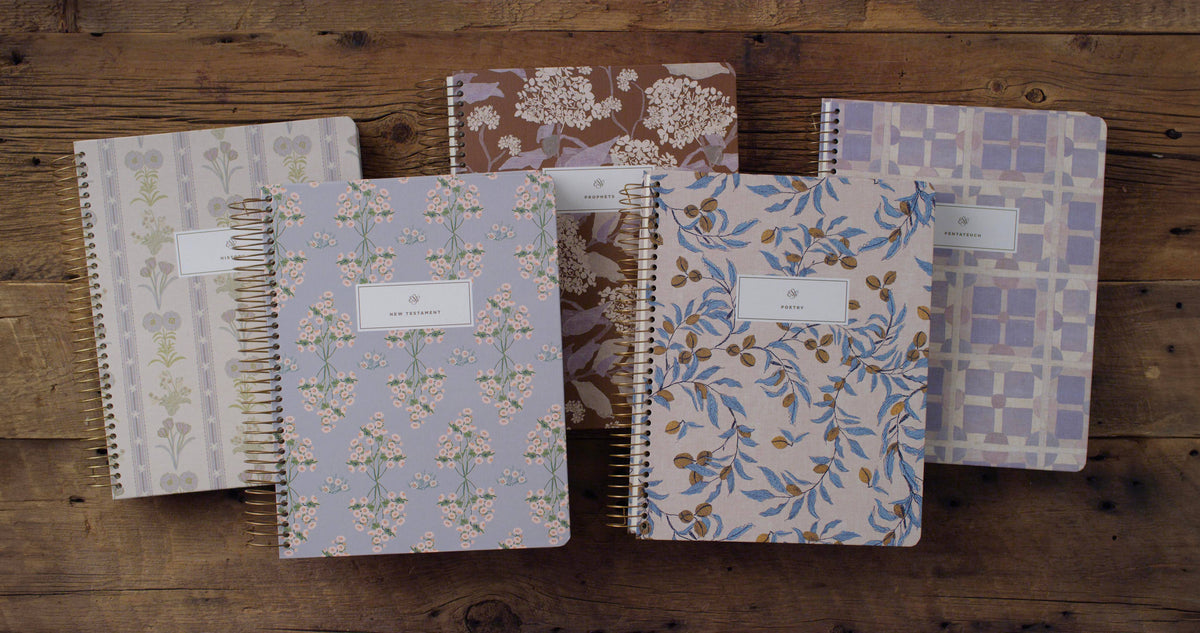 Five floral hardcover ESV journaling Bible volumes designed by Lulie Wallace