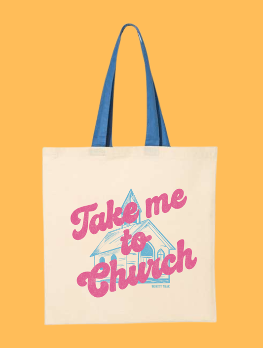 Take Me to Church Christian canvas tote bag with pink lettering blue handles and church graphic