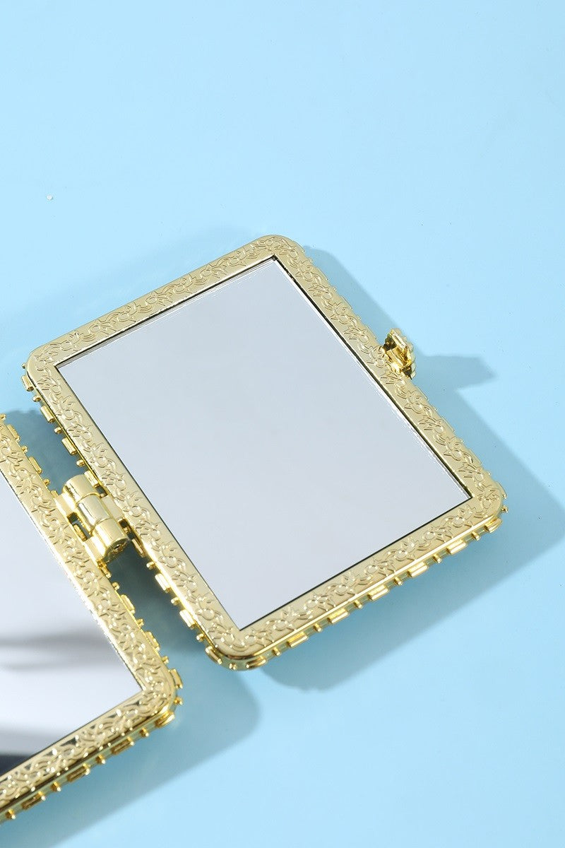 Interior view of the Petal Keepsake double-sided rectangular travel makeup mirror