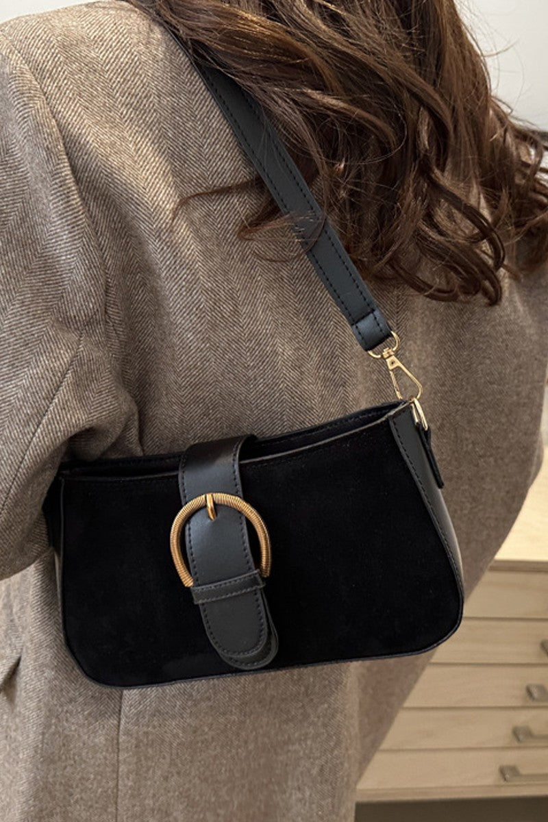 Black suede and vegan leather women’s handbag with round gold buckle
