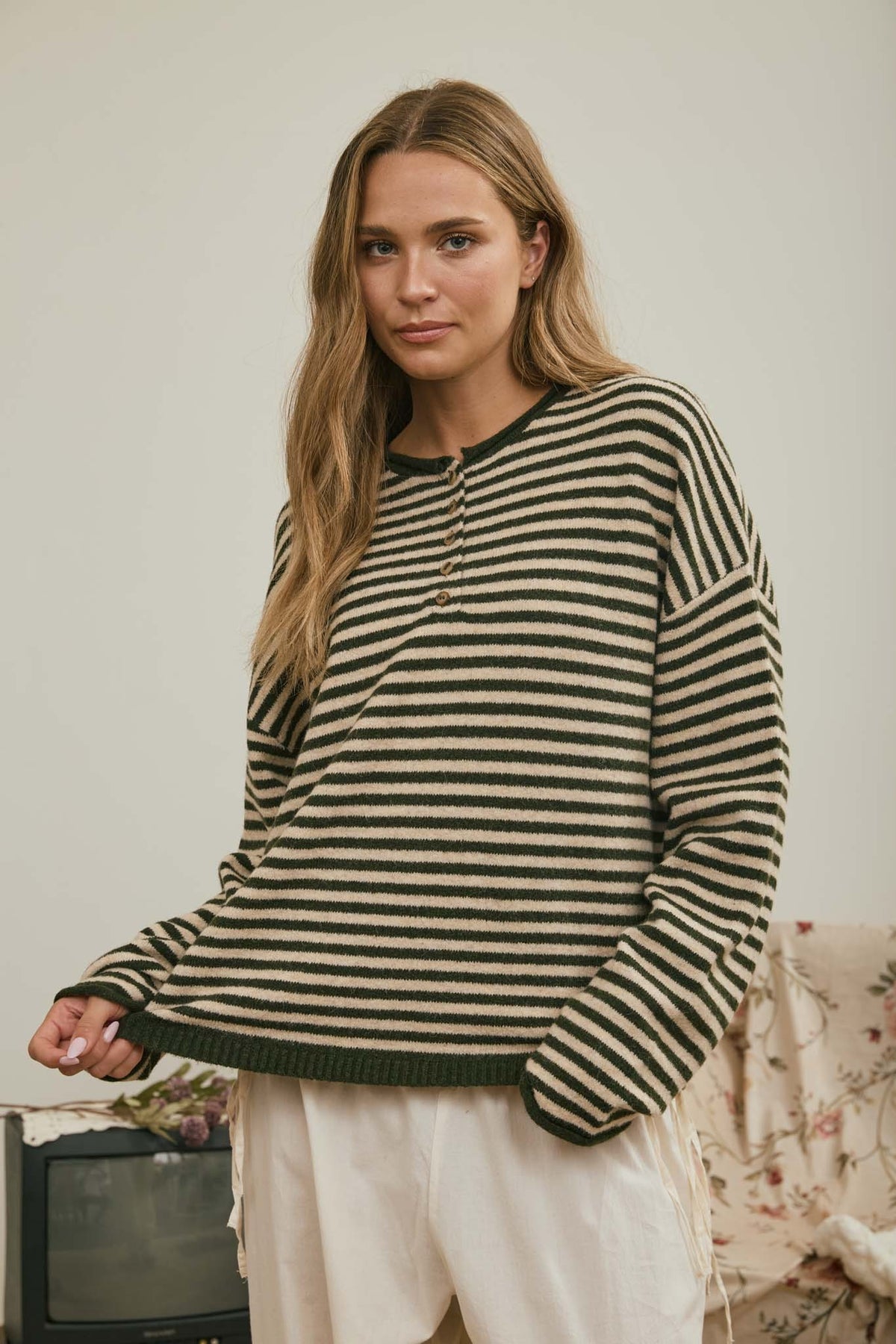 Evergreen green and cream striped Henley sweater with button neckline