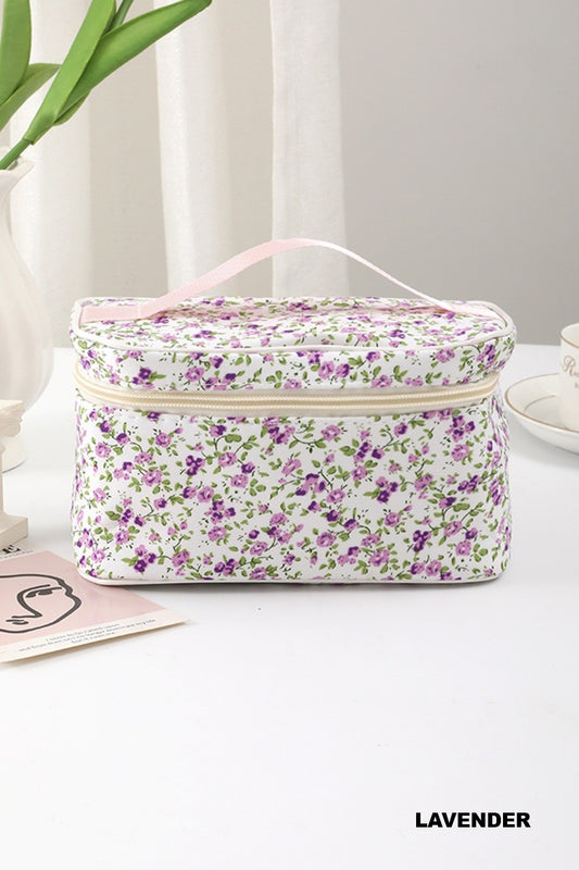 Garden Getaway quilted travel makeup bag with a lavender ditsy floral pattern, zipper closure, and carrying handle