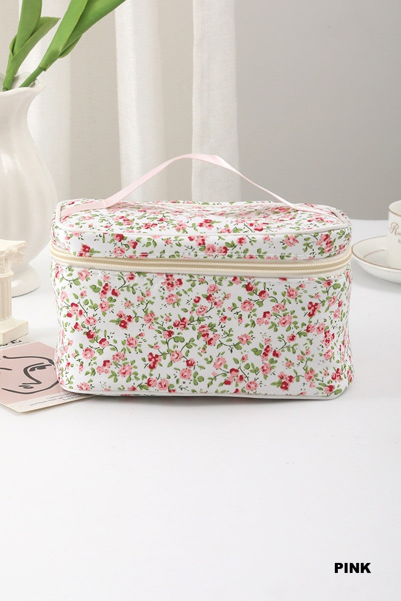 Garden Getaway quilted cosmetic organizer with a pink ditsy floral pattern, zip-around closure, and top handle