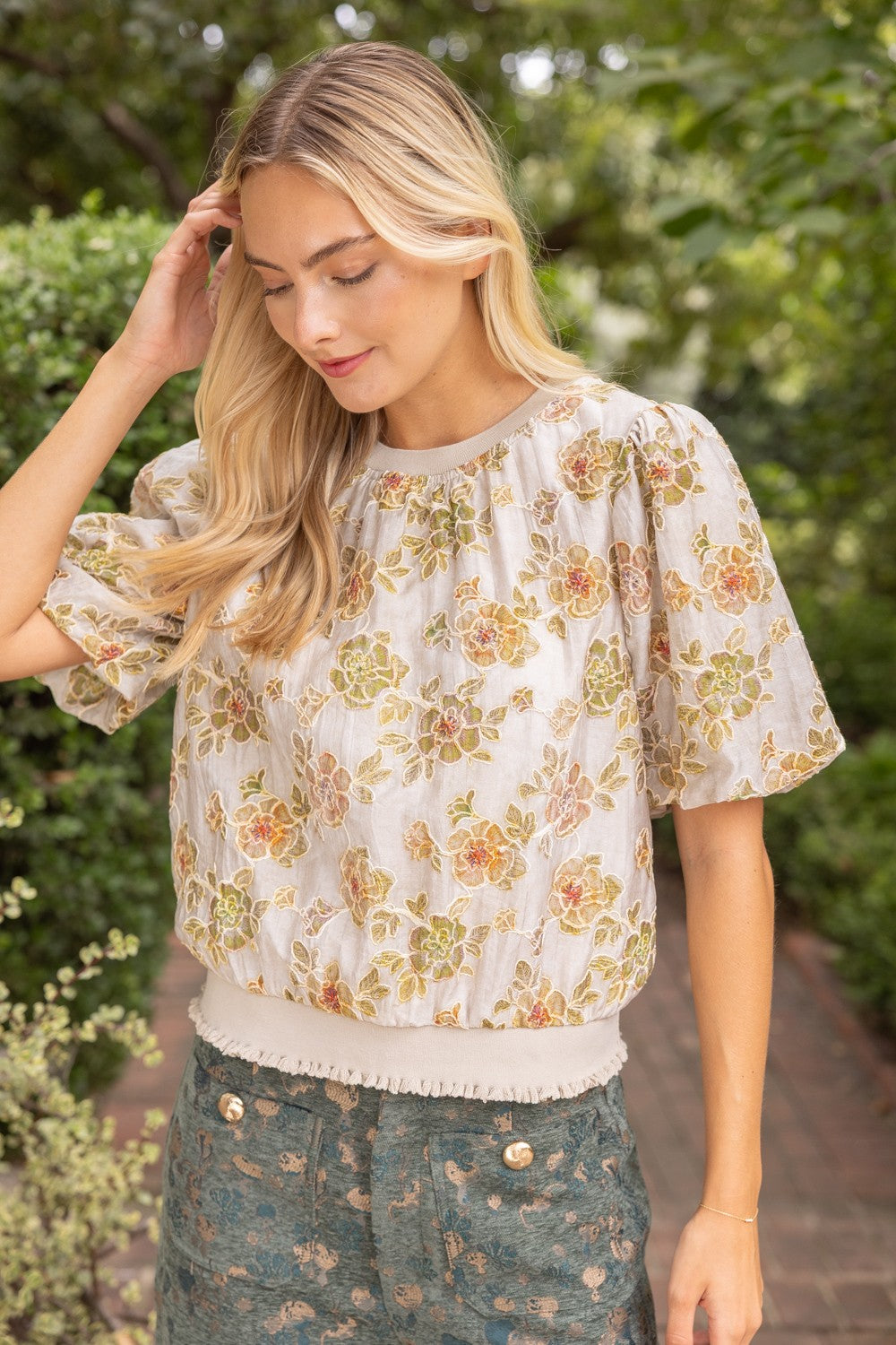Women’s taupe embroidered floral puff sleeve top with fringe hem
