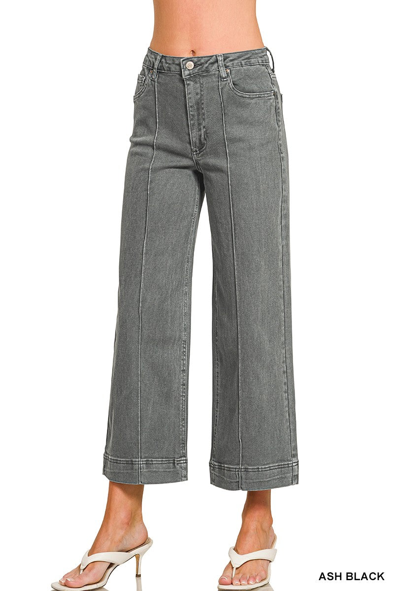 Front view of the Sloane women’s Ash Black high-rise cropped wide-leg jeans with pintuck seams and a wide cuffed hem