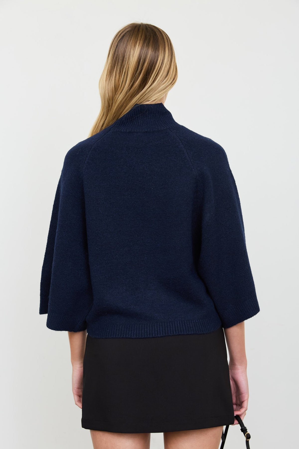 Back view of the Audrey relaxed-fit navy mock-neck pullover sweater