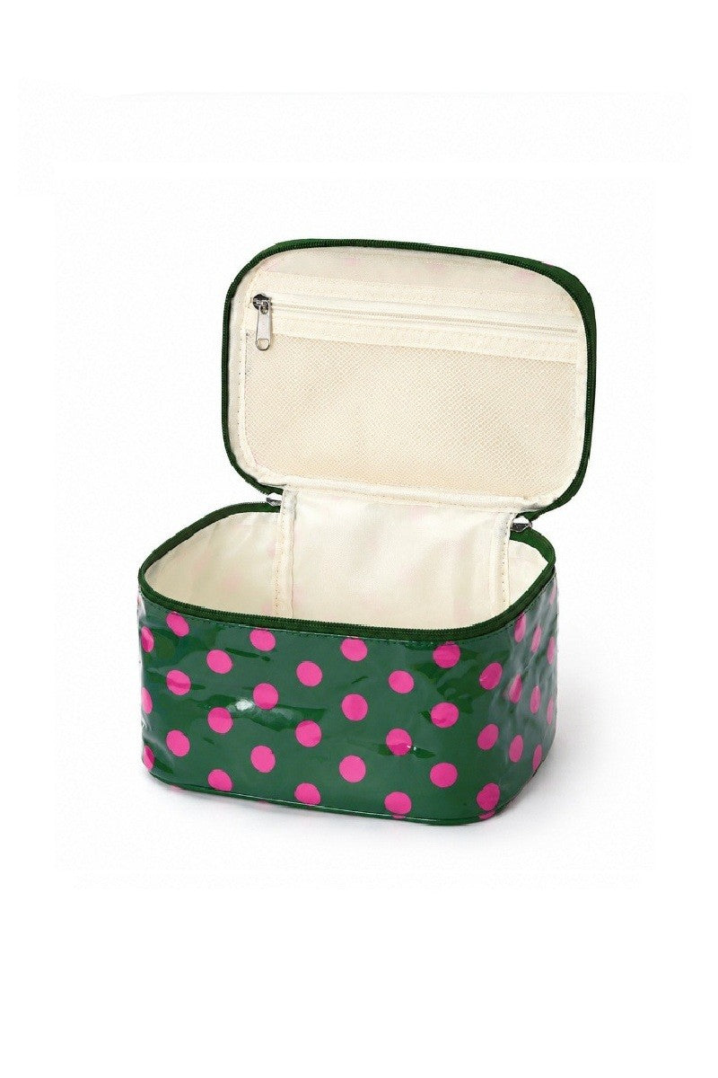 Open green cosmetic travel case with pink polka dots and zippered interior pocket