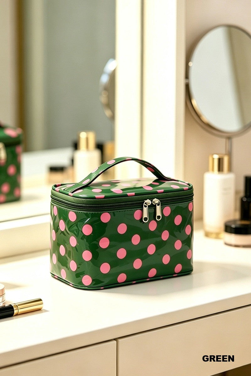 Green waterproof cosmetic bag with pink polka dots, double zipper, and carrying handle