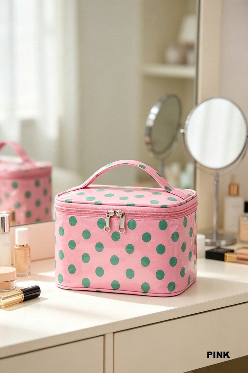 Pink waterproof makeup bag with green polka dots and silver-tone zipper closure