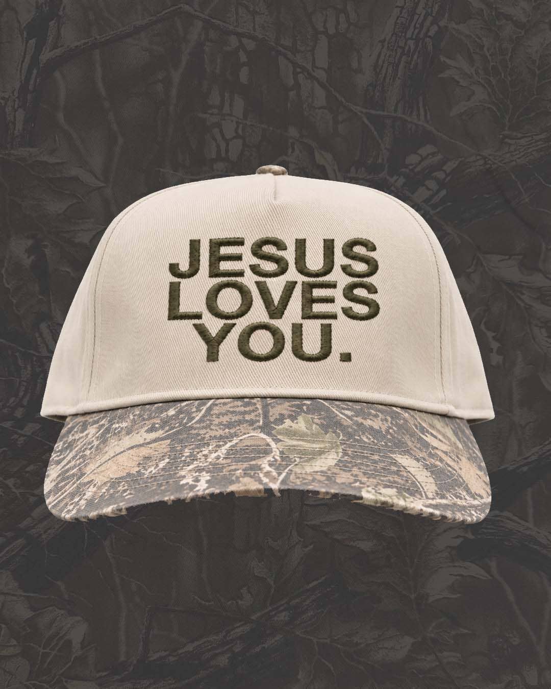 Jesus Loves You Outdoorsman Christian snapback hat with neutral crown, olive embroidery and distressed woodland camo bill

