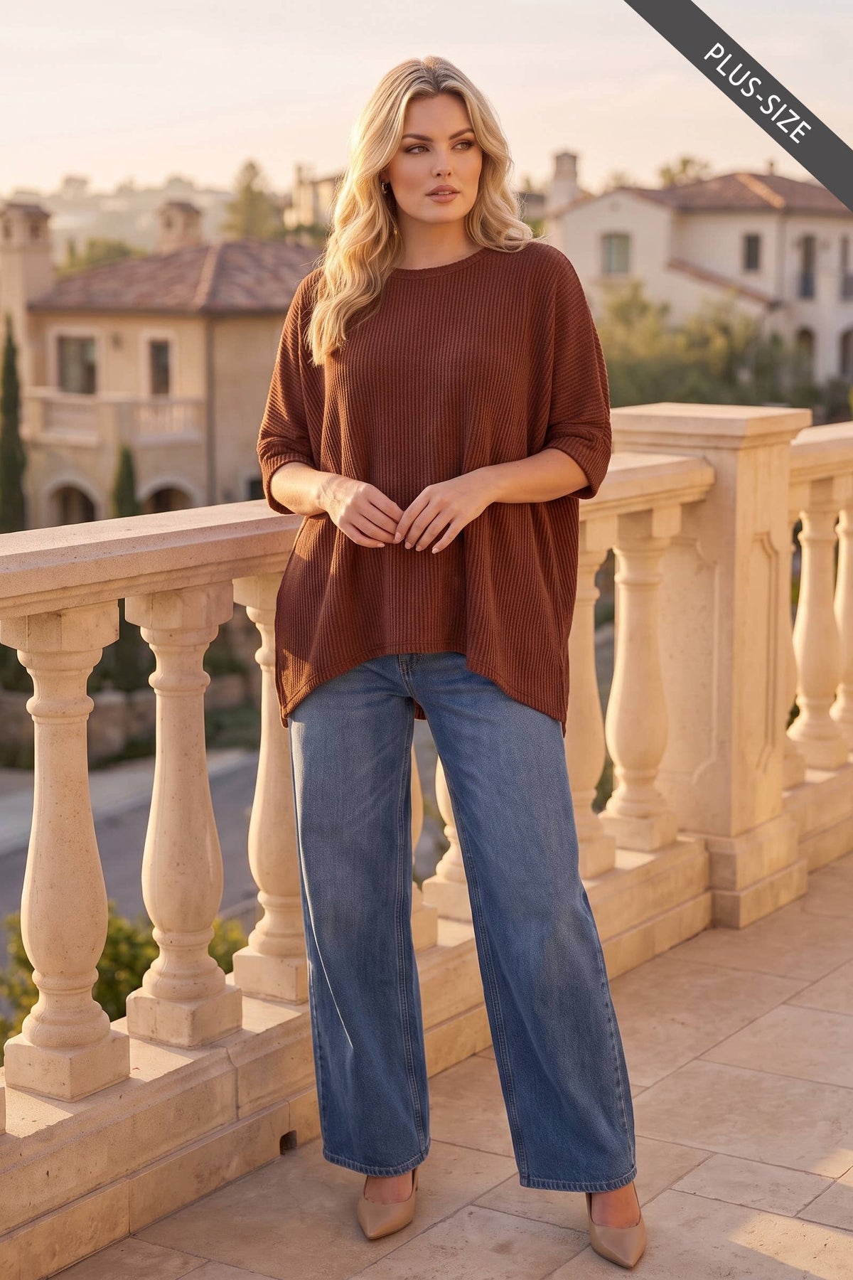 Plus-size women’s rust oversized ribbed knit top with high-low hem