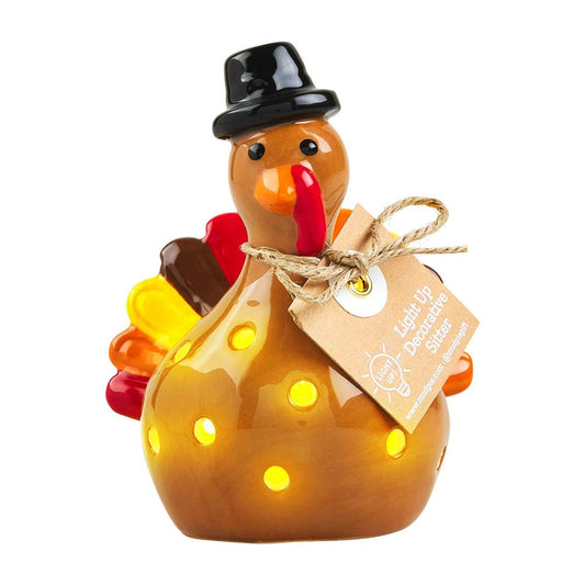 Mud Pie Light-Up Turkey Sitter ceramic Thanksgiving decoration with glowing LED lights and black pilgrim hat