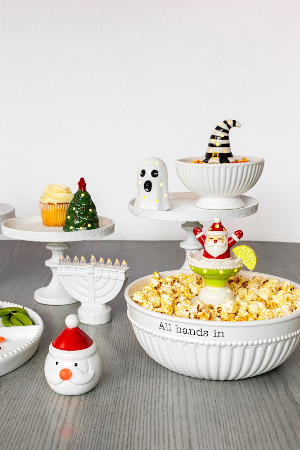 Mud Pie Christmas light-up tree sitter displayed with other seasonal LED figurines and holiday serving bowls