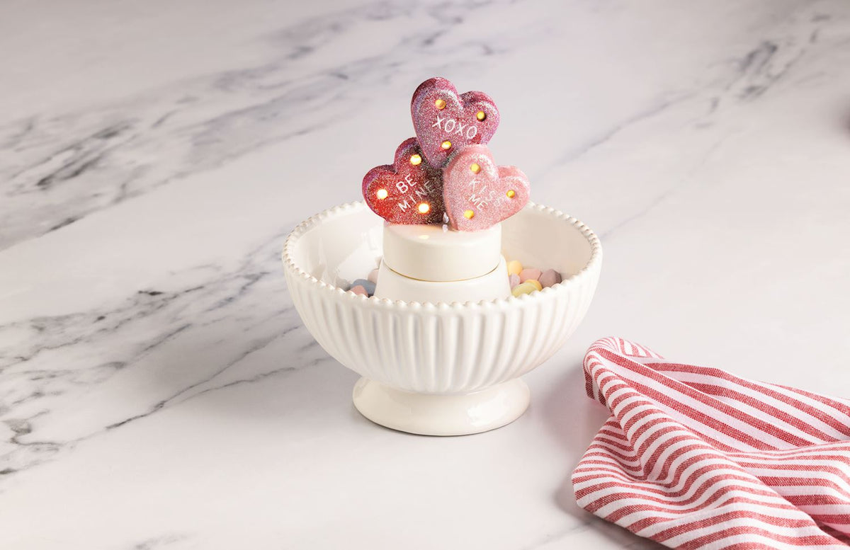 Mud Pie Valentine’s Conversation Heart Light-Up Sitter styled on a table for Valentine’s Day
