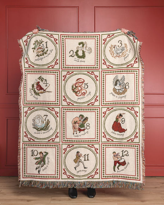 12 Days of Christmas woven jacquard blanket with vintage holiday illustrations and fringe trim