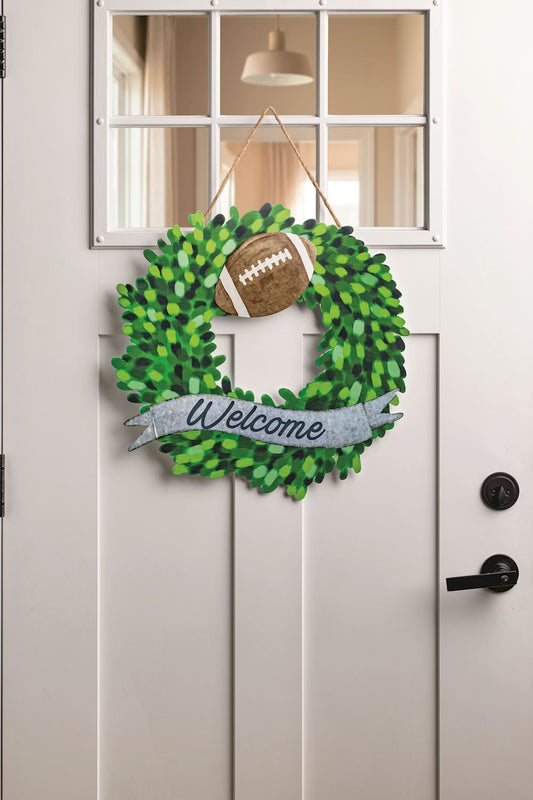 Welcome tin wreath with interchangeable football attachment on front door