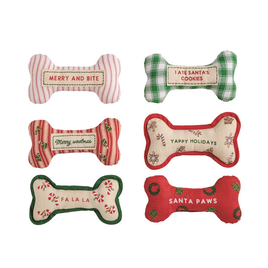 Assorted Christmas dog bone squeaky toys with festive holiday patterns and sayings