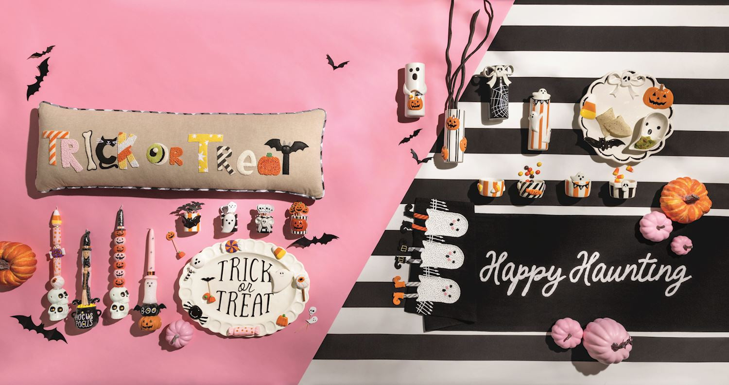 Mud Pie Happy Haunting ghost table runner styled with Halloween pumpkins and coordinating spooky tabletop decor