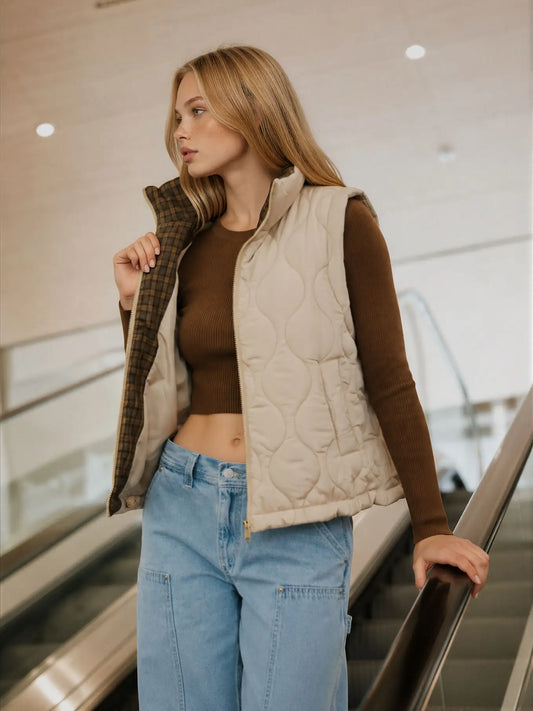 Women’s beige wave quilted zip-up vest with contrast plaid collar