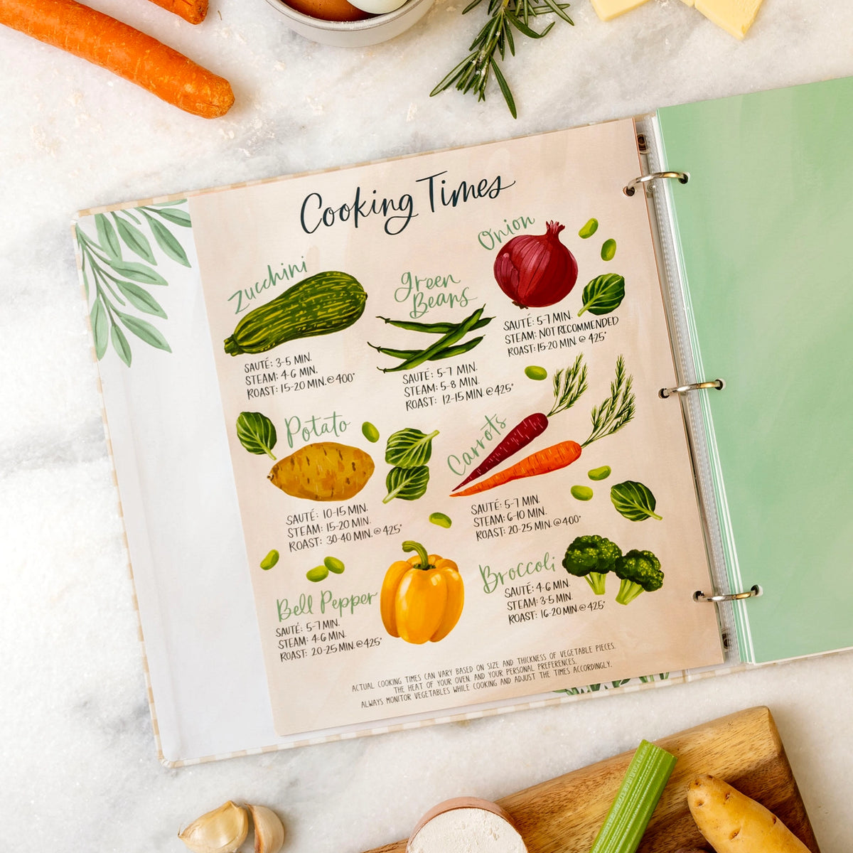 Illustrated vegetable cooking times guide inside large recipe binder