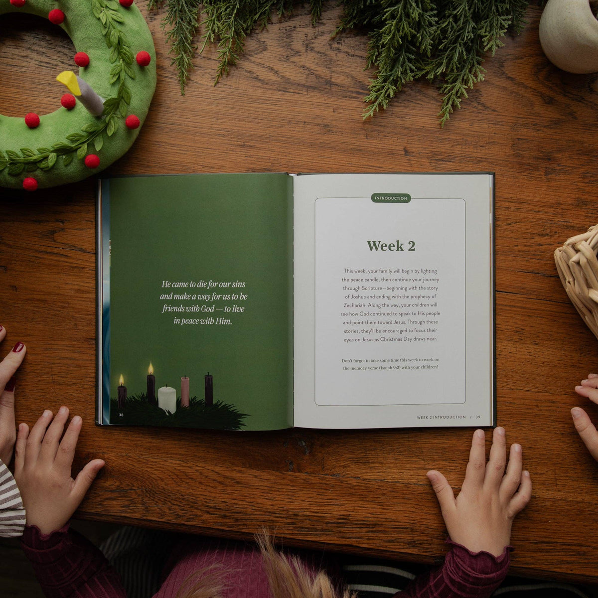 Inside The Advent Storybook showing week two peace candle lighting, Isaiah Scripture reading and Christian Advent devotional for families.
