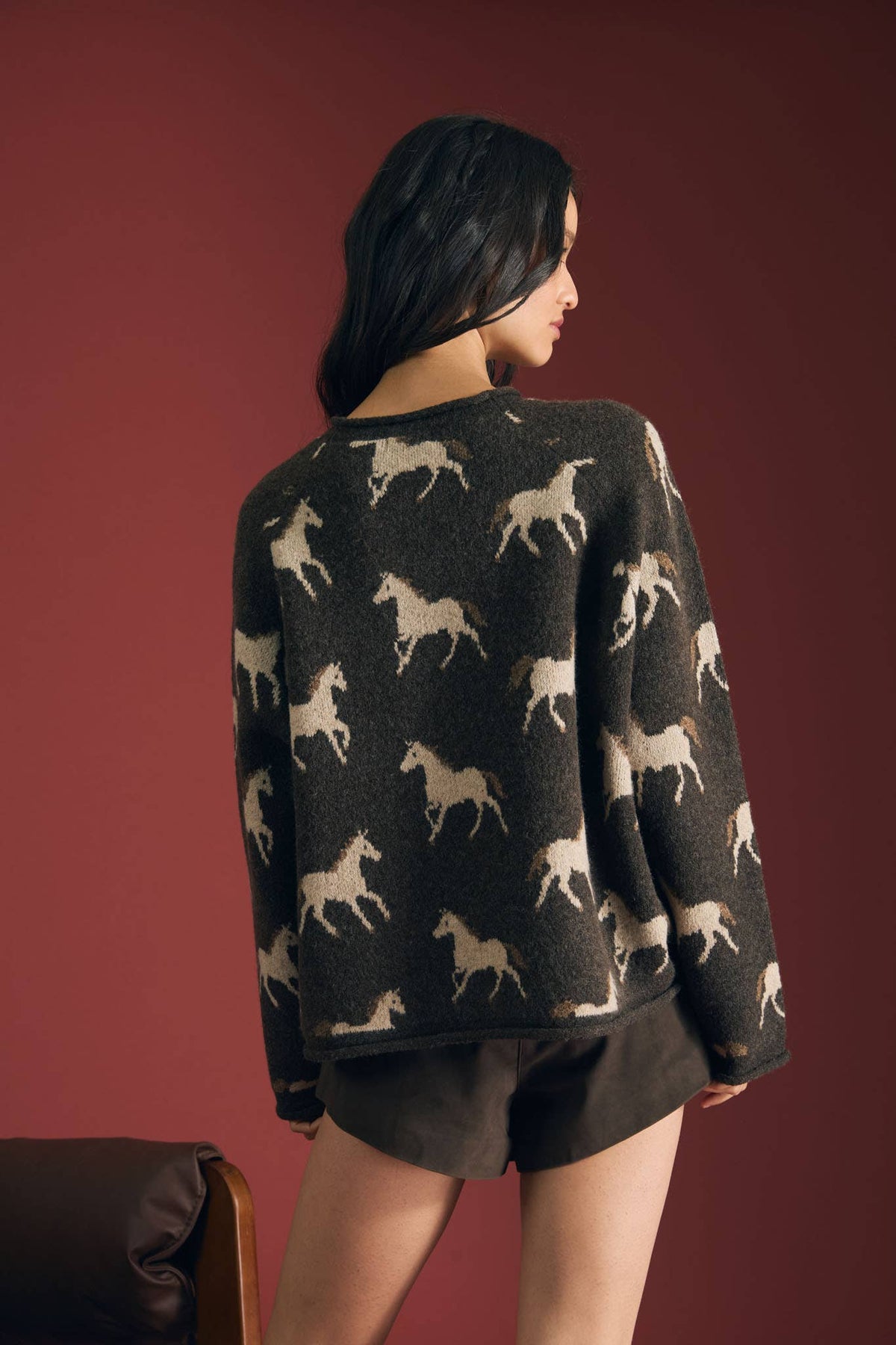 Back view of women’s charcoal western horse print sweater
