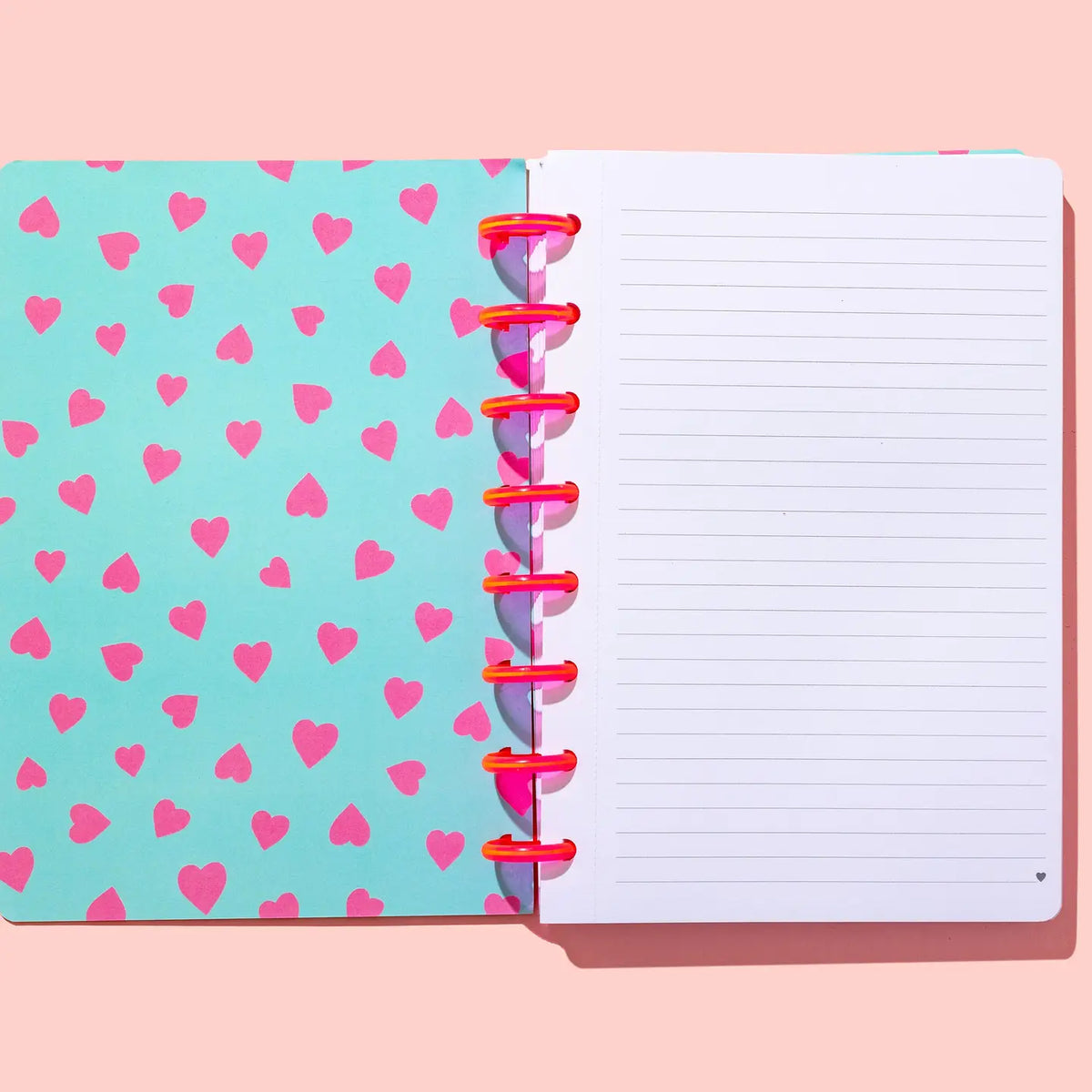 Christian faith notebook with 200 lined perforated pages, heart print inside cover and pink disc binding