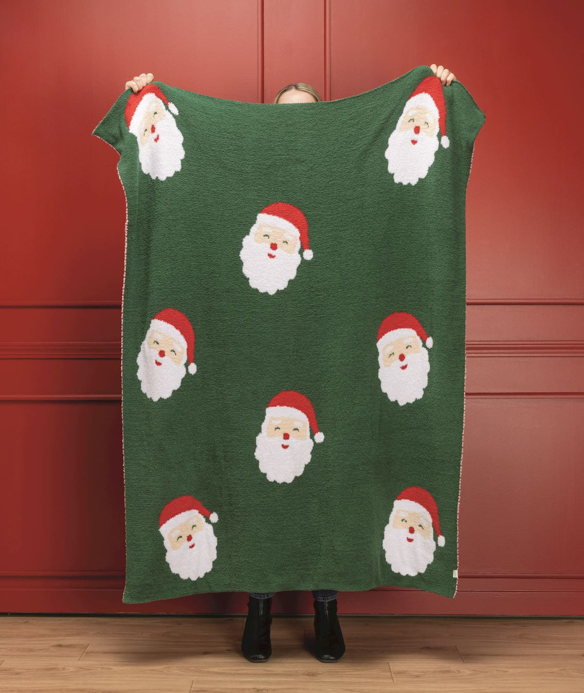 Green vintage Santa chenille Christmas throw blanket with repeating Santa faces
