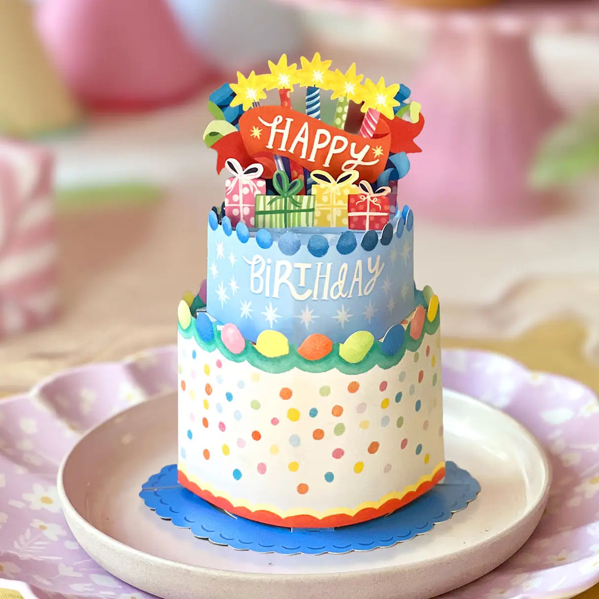 FreshCut Paper Mini Confetti Birthday Cake 3D pop-up greeting card featuring colorful polka dots, birthday candles, miniature gifts, and matching Happy Birthday notecard