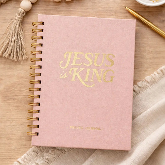 Jesus Is King blush pink Christian prayer journal with gold lettering and spiral binding