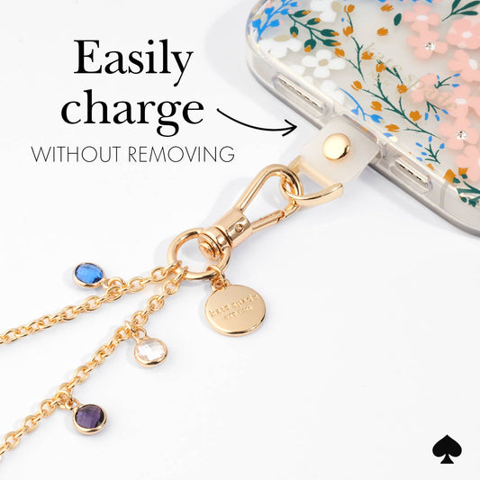 Kate Spade High Shine gold phone charm attached to phone case with charging port accessible