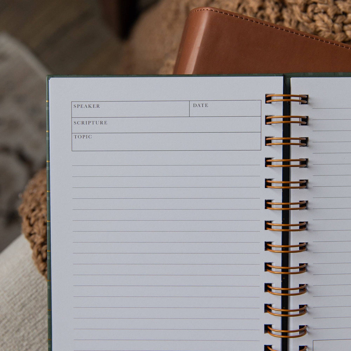 Close-up of The Daily Grace Co sermon journal interior with designated spaces for Bible verses, sermon topic, speaker, and date.