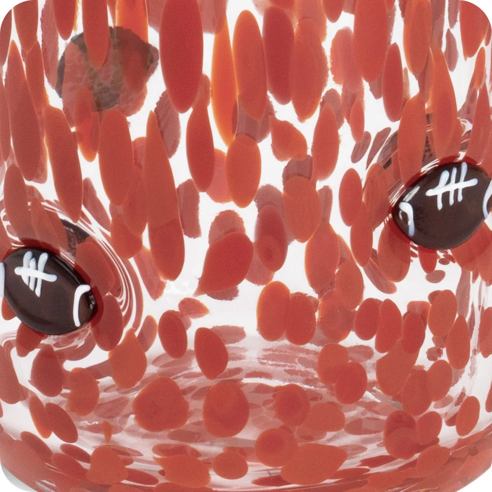 Close-up of Swig red handblown glass with 3D football charms