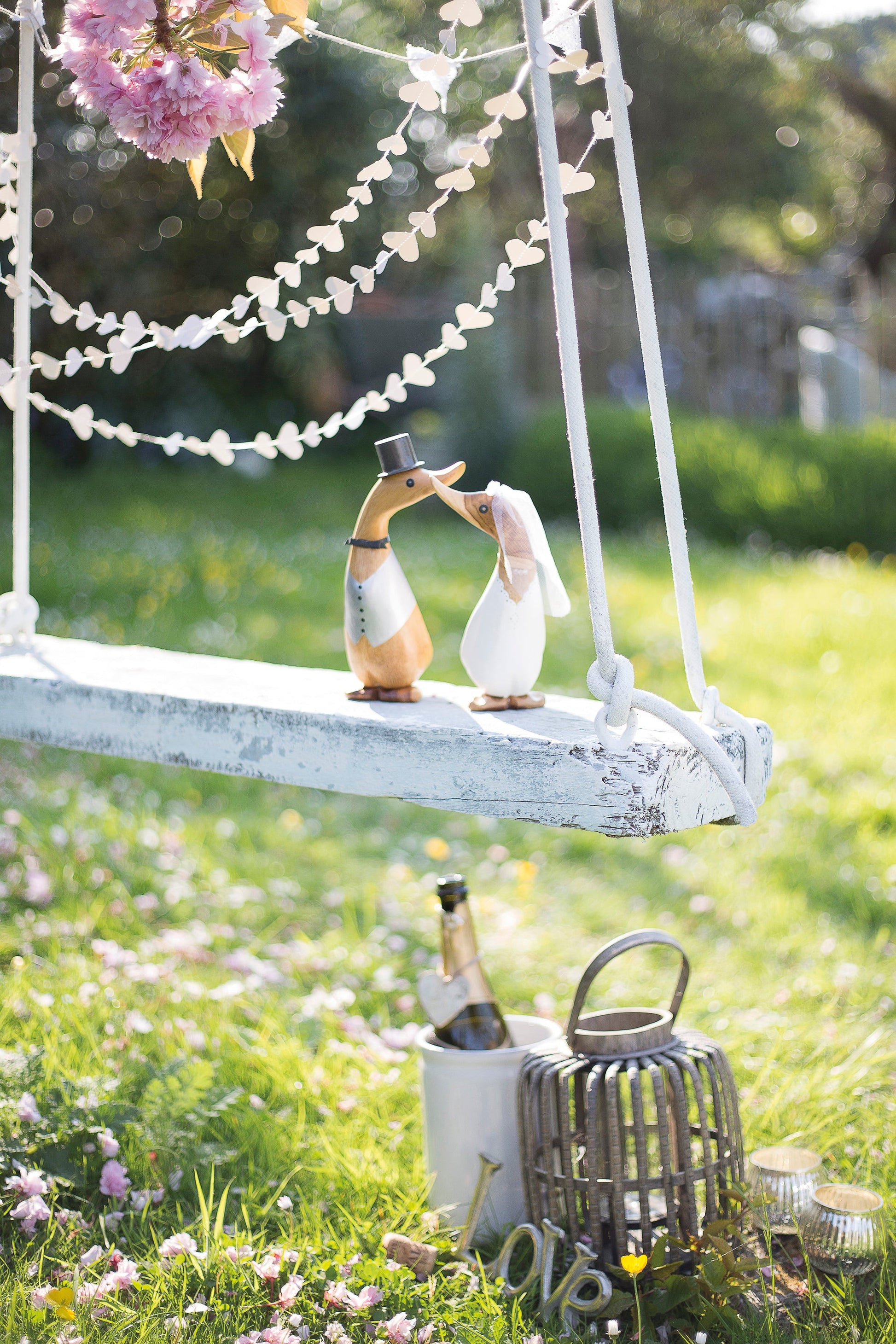 D.C.U.K. bride and groom wedding ducklings on outdoor swing wedding display
