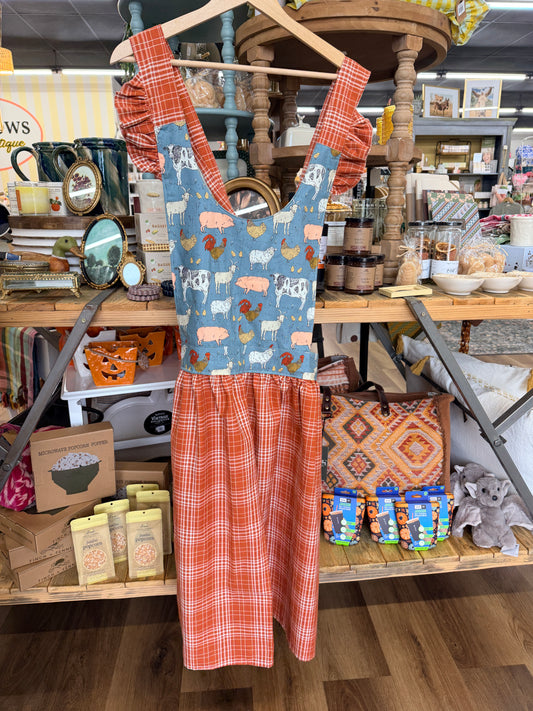 Handmade farmhouse crossback apron with blue farm animal print rust plaid skirt and ruffled straps