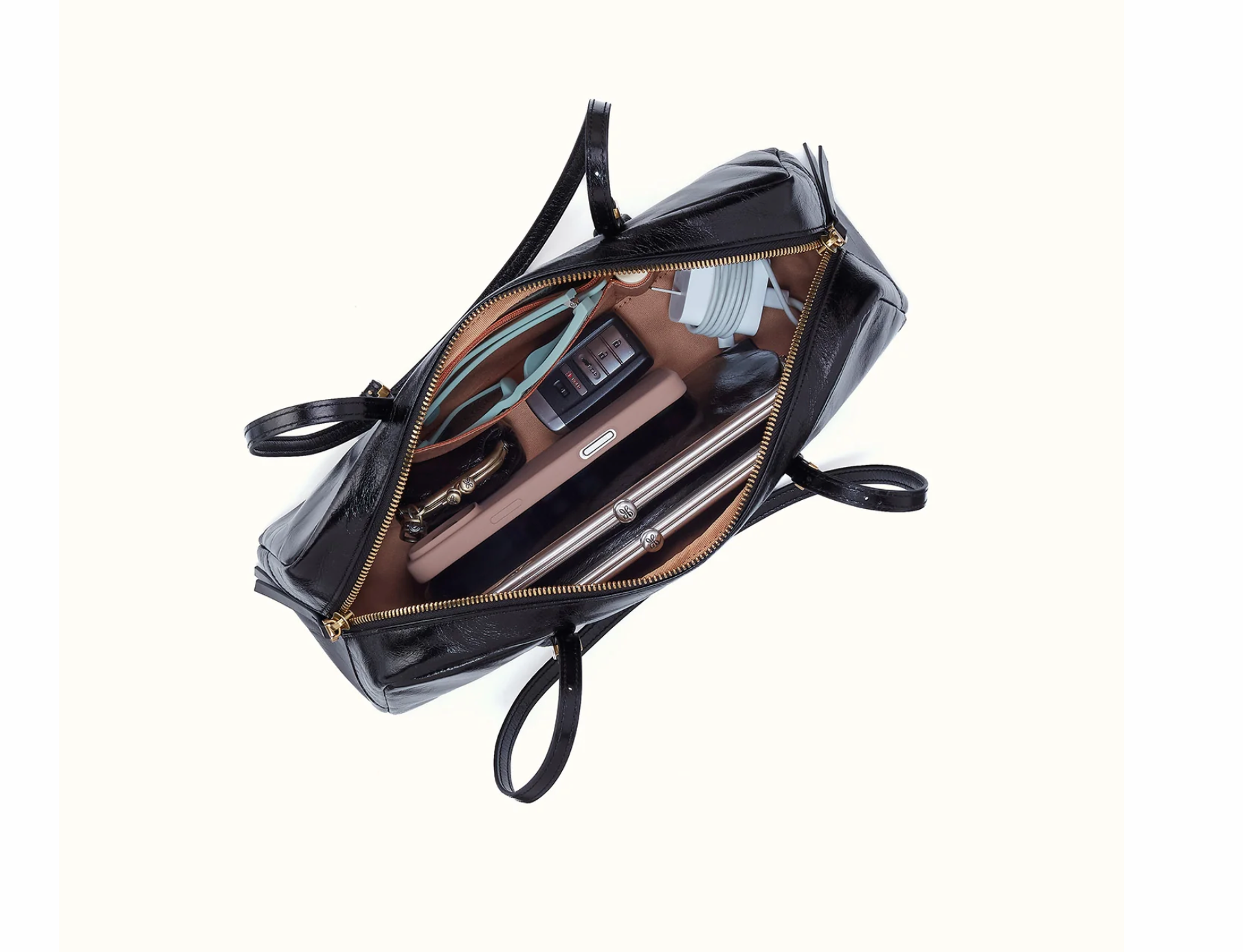 Interior of HOBO Scottie Satchel showing zip and slip pockets with Sandlewood lining
