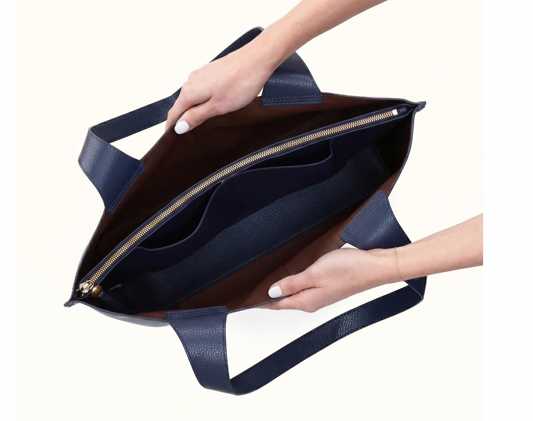 Interior of HOBO Vida Large Tote in Mood Indigo with center zip compartment and organization pockets