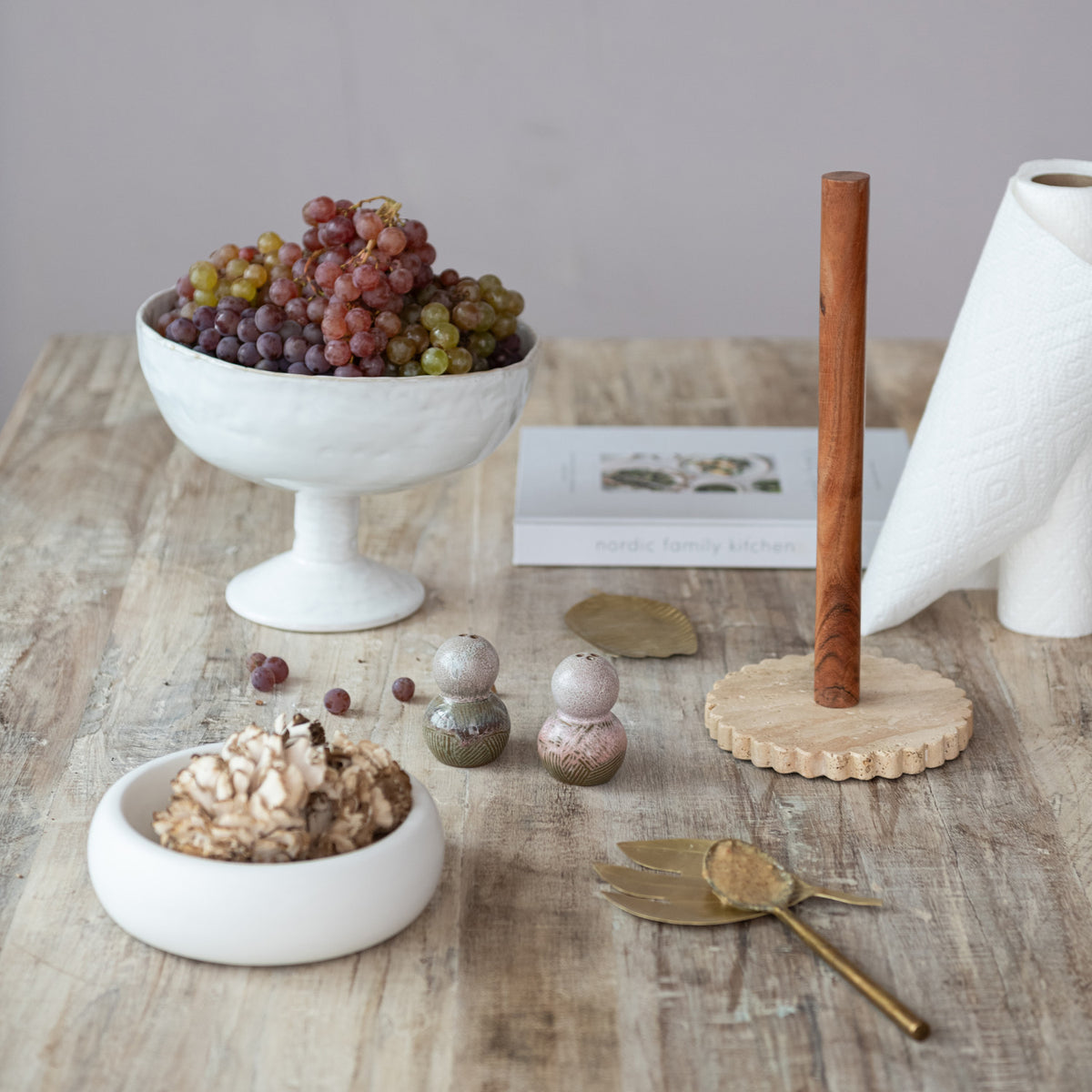 Scalloped cream travertine paper towel holder with natural acacia wood rod for kitchen countertop