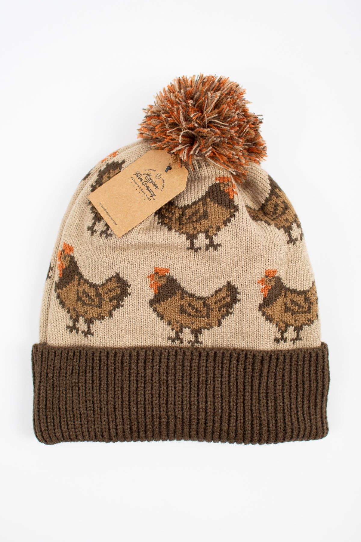 Brown chicken knit pom-pom beanie featuring an oatmeal background, chicken pattern, chocolate brown cuff and multicolored pom-pom.
 Copy