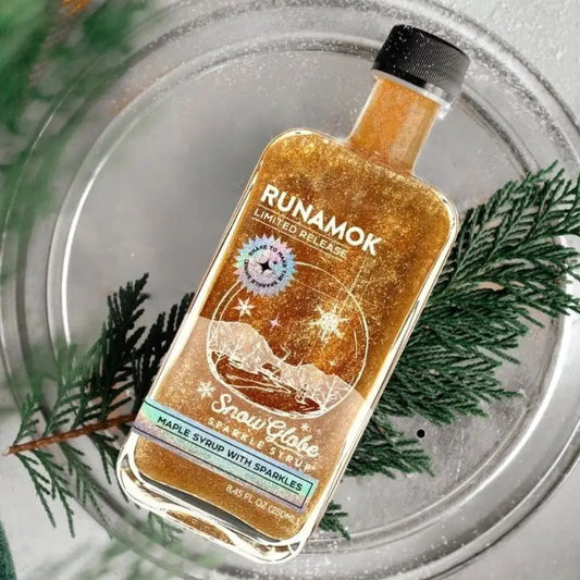 Runamok Snow Globe Sparkle Maple Syrup limited release holiday bottle in snow