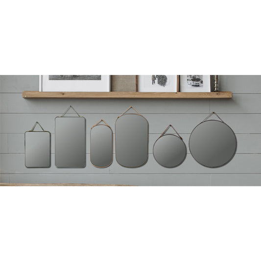 Six velvet framed mini wall mirrors in round oval and rectangle shapes
