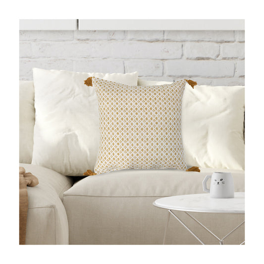 Cream and mustard 20 inch cotton throw pillow with geometric pattern and corner tassels