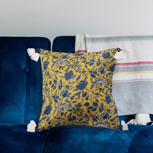 Blue and chartreuse 18 inch cotton floral throw pillow with white corner tassels
